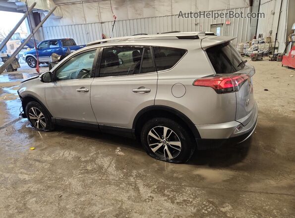 2T3RFREV8GW509323 2016 TOYOTA LE Silver Tył lewy