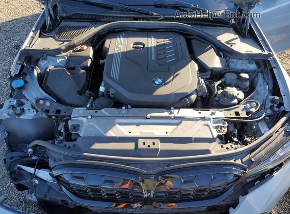 3MW49FF07R8E21103 2024 BMW M3 Серый Вид задней части салона