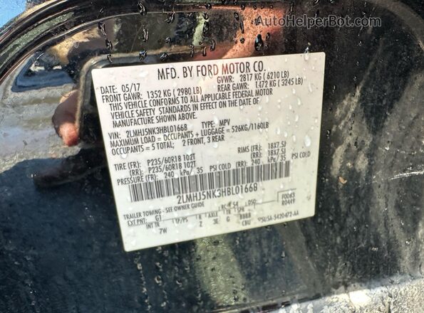 2LMHJ5NK3HBL01668 2017 LINCOLN MKT Черный Вид задней части салона