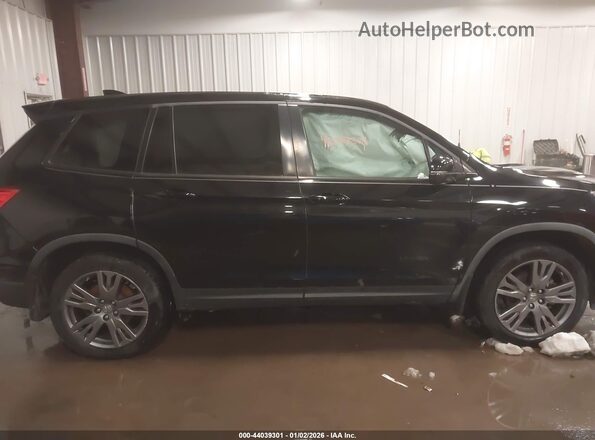 5FNYF8H50LB009156 2020 HONDA PASSPORT Черный Вид задней части салона