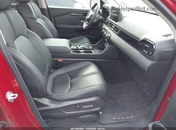 5FNYG1H40PB039517 2023 HONDA PILOT Красный Вид салона спереди