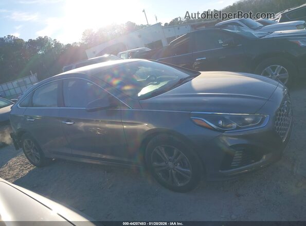 5NPE34AF9KH814306 2019 HYUNDAI SONATA Серый Вид задней части салона