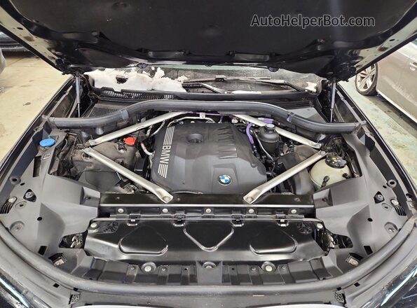 5UX23EM00P9S06012 2023 BMW X7 Black VIN կոդի պիտակի տեսք