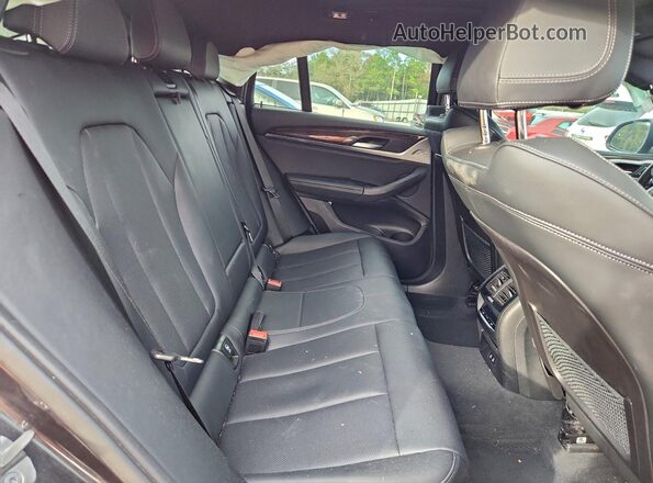 5UX33DT01P9P68985 2023 BMW X4 Серый Вид задней части салона