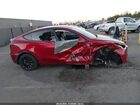 2024 Tesla Model Y Rwd Burgundy vin: 7SAYGDED6RF129542