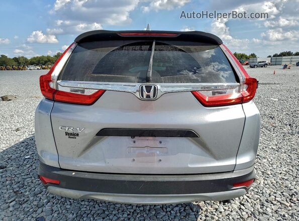 2HKRW5H34KH422683 2019 HONDA CRV Серебряный Вид салона спереди