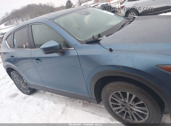 JM3KFBCL0H0104807 2017 MAZDA CX-5 Light Blue Vista interior trasera