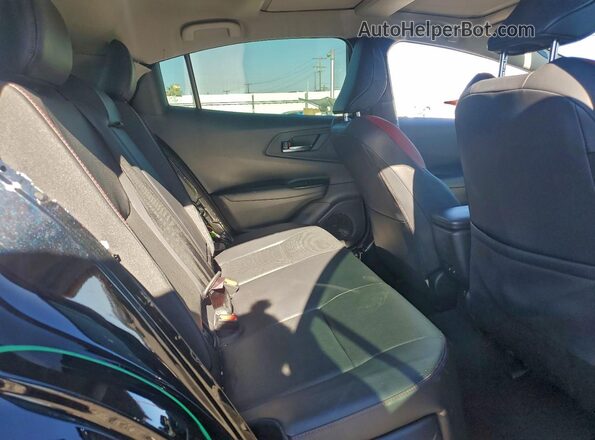 JTDACACUXR3025693 2024 TOYOTA PRIUS Black Rear interior view