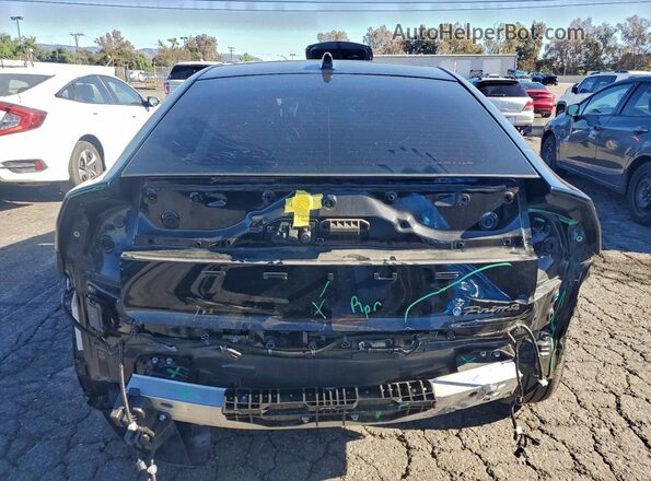 JTDACACUXR3025693 2024 TOYOTA PRIUS Black Rear view