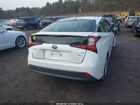 2021 Toyota Prius L Eco Белый vin: JTDKAMFUXM3151813