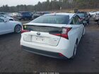 2021 Toyota Prius L Eco Белый vin: JTDKAMFUXM3151813