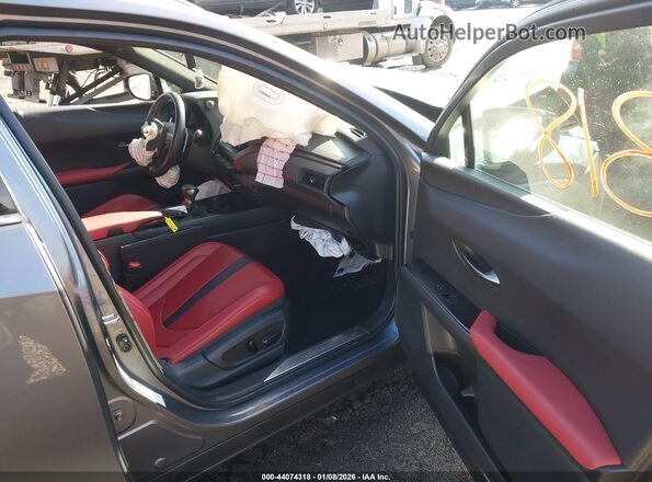 JTHU9JBH9K2000696 2019 LEXUS UX 250H Pewter Вид салона спереди