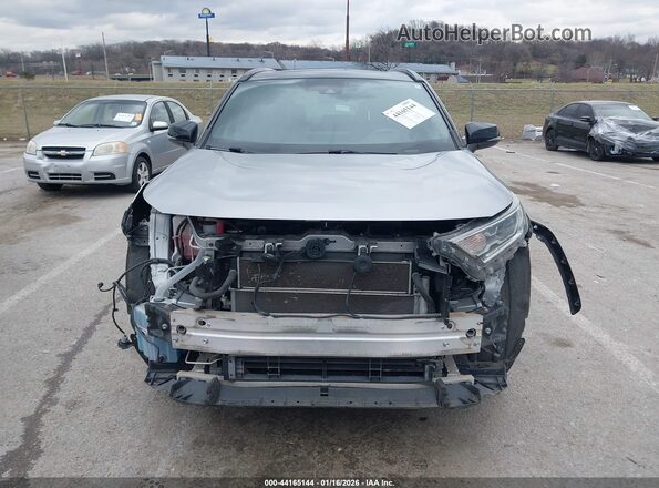 JTMEWRFVXKJ004100 2019 TOYOTA RAV4 HYBRID Серебряный Вид задней части салона