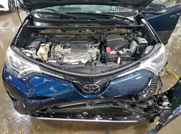 JTMWFREV0JJ752827 2018 TOYOTA RAV4 Blue Вид задньої частини салону