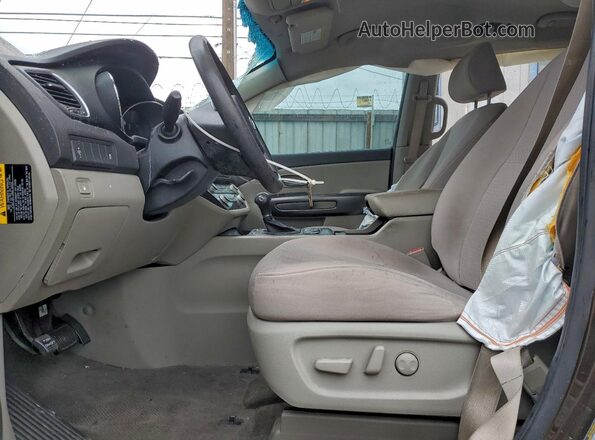 KNDMB5C17G6102609 2016 KIA SEDONA Коричневый Вид салона спереди