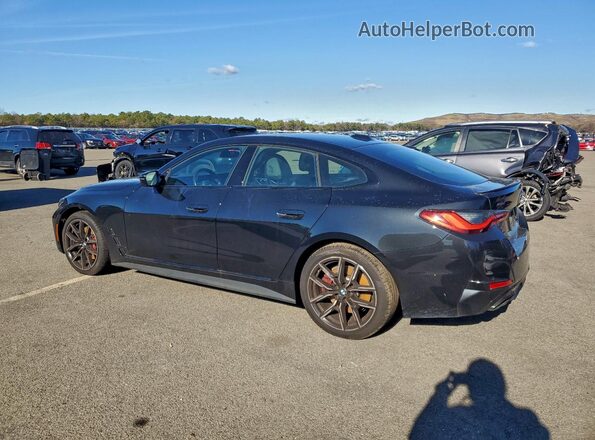 WBA13AW06RFT28197 2024 BMW M4 Черный Задняя левая четверть