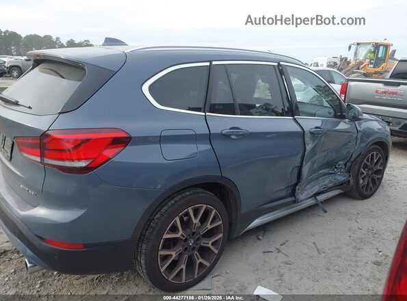 WBXJG7C07L3L85650 2020 BMW X1 Gray Вид задньої частини салону