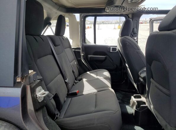 1C4HJXDG2PW672939 2023 JEEP WRANGLER Gray Widok wnętrza z tyłu