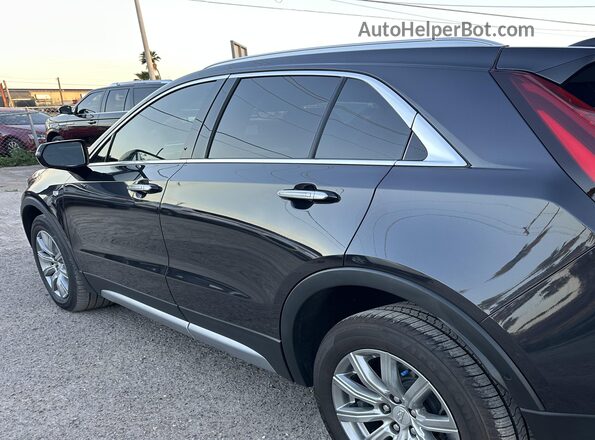 1GYFZDR43PF174188 2023 CADILLAC XT4 Black Tył lewy