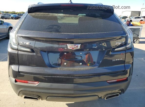 1GYFZER47PF100682 2023 CADILLAC XT4 Черный Вид сзади