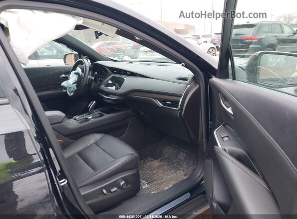 1GYFZFR47MF031302 2021 CADILLAC XT4 Black წინა სალონის ხედი
