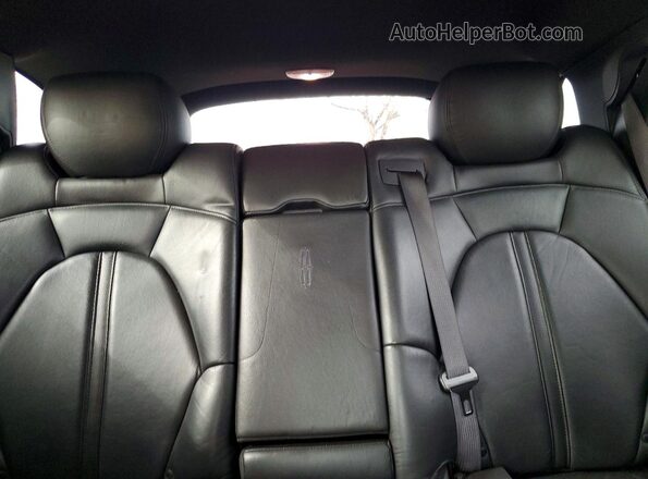 2LMHJ5NK8GBL00806 2016 LINCOLN MKT Черный Вид задней части салона