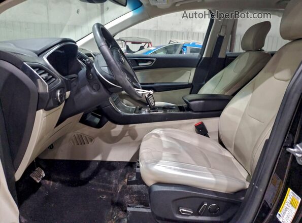 2FMPK3K94KBB04607 2019 FORD EDGE Черный Вид салона спереди