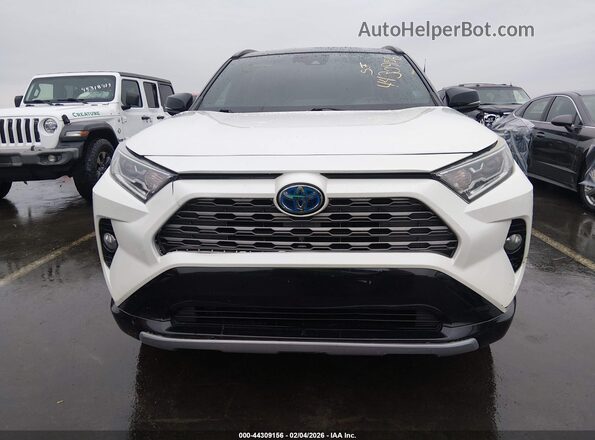 2T3EWRFV9KW040751 2019 TOYOTA RAV4 HYBRID White Widok wnętrza z tyłu