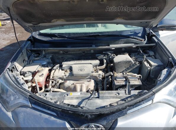 2T3RFREVXGW537088 2016 TOYOTA LE Серебряный Вид сзади