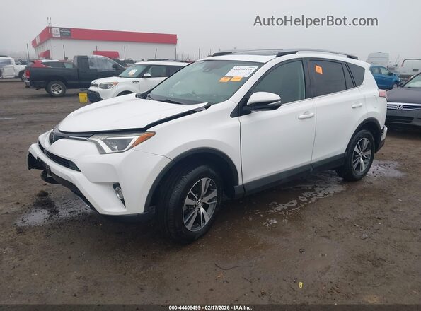2T3WFREV2JW422074 2018 TOYOTA LE White Vista tres cuartos delantera izquierda