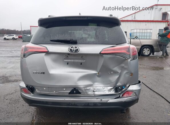 2T3ZFREV2GW267113 2016 TOYOTA LE Серебряный 