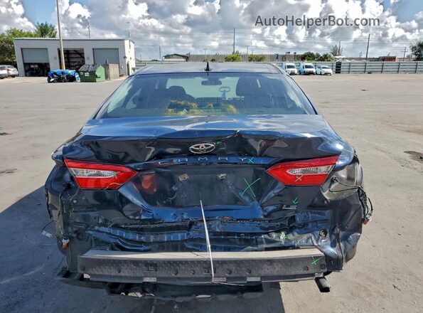 4T1B11HK2KU704600 2019 TOYOTA CAMRY Синий Вид салона спереди