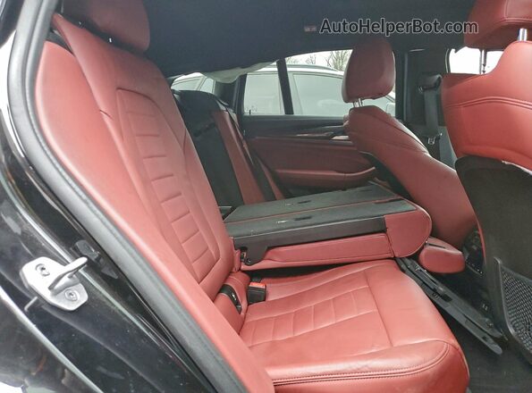 5UX2V5C07M9G28627 2021 BMW X4 Black Widok wnętrza z tyłu