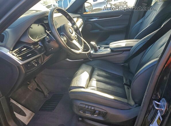 5UXKU2C50K0Z64597 2019 BMW X6 Черный Вид салона спереди