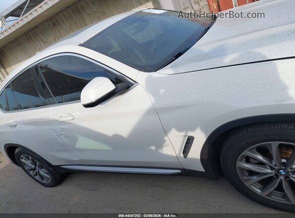 5UXUJ3C59KLG54375 2019 BMW X4 Белый Вид задней части салона