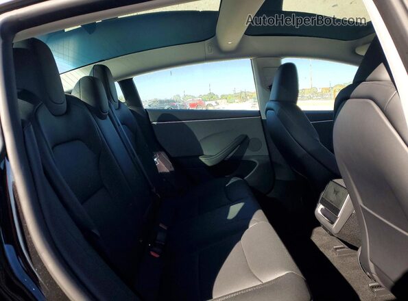 5YJ3E1EA2SF042602 2025 TESLA MODEL Black უკანა სავარძლების ხედი