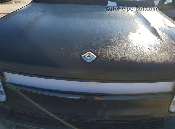 7PDSGBBA9RN033044 2024 RIVIAN R1S Черный Вид задней части салона