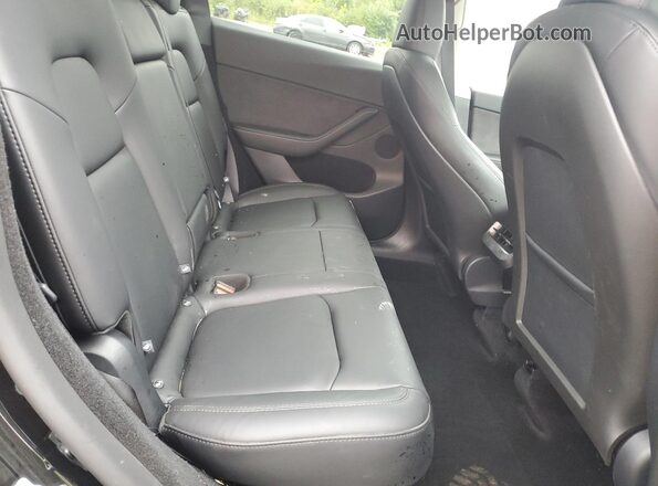 7SAYGDED8SF247954 2025 TESLA MODEL Black Vista interior trasera