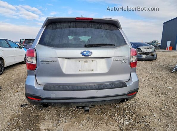 JF2SJGVC9GH412495 2016 SUBARU FORESTER2. Silver Vista trasera