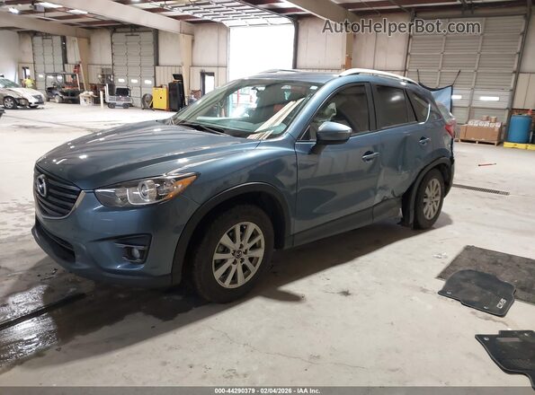JM3KE2CY4G0899910 2016 MAZDA CX-5 Light Blue Vista tres cuartos delantera izquierda