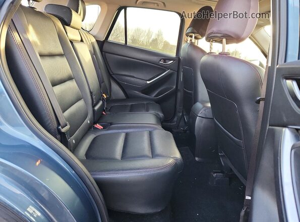 JM3KE4DY2G0664237 2016 MAZDA CX-5 Blue Rear interior view