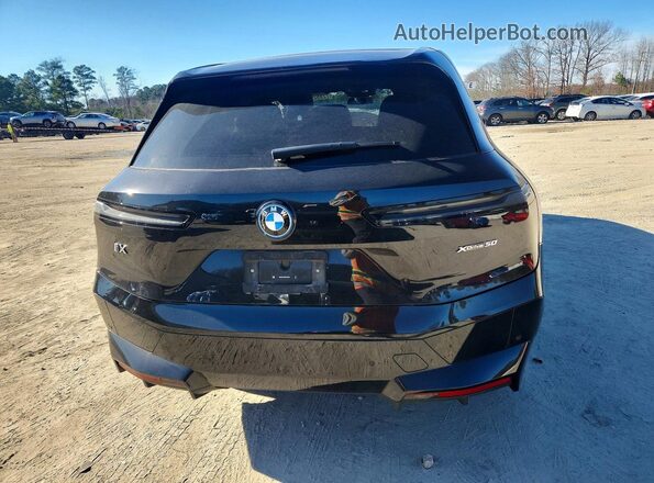 WB523CF00SCS31390 2025 BMW IX Черный Вид сзади