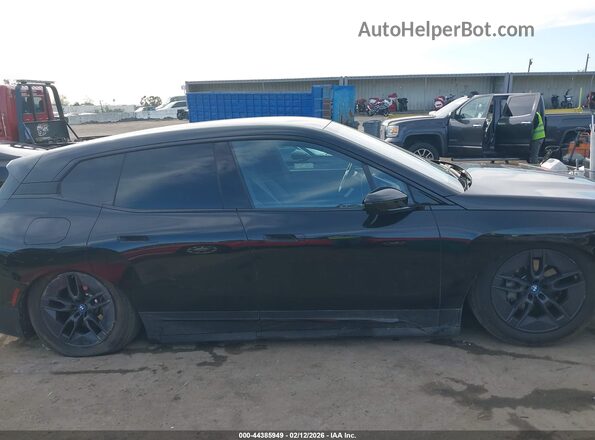 WB523CF01SCS53446 2025 BMW IX Black Вид задньої частини салону