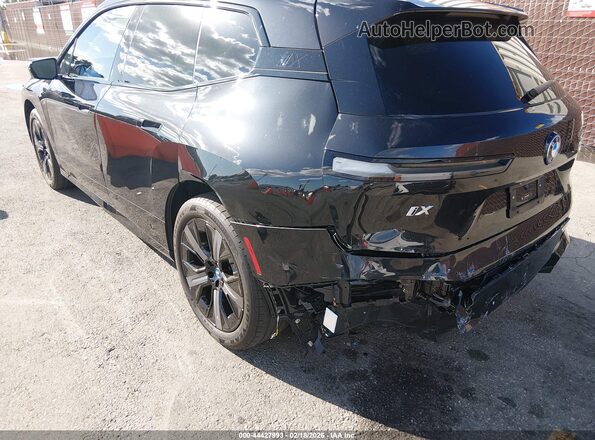 WB523CF09RCP90639 2024 BMW IX Black Trasero izquierdo