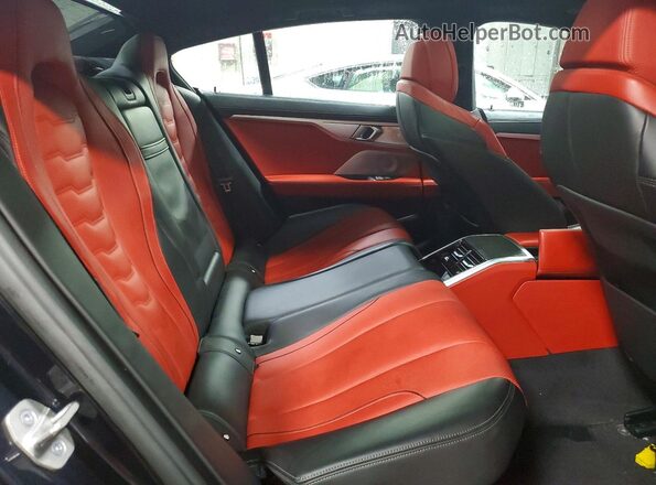 WBAGV8C00PCL61874 2023 BMW M8 Black Widok tylnych siedzeń