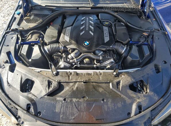 WBAGV8C02PCL67191 2023 BMW M8 Blue Widok wnętrza z tyłu