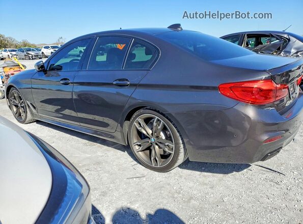 WBAJS7C06LCD34796 2020 BMW M5 Charcoal Rear left