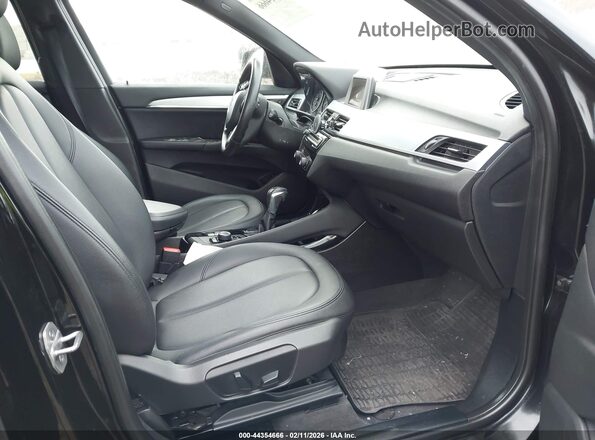 WBXHT3C30GP883734 2016 BMW X1 Black Vista interior delantera