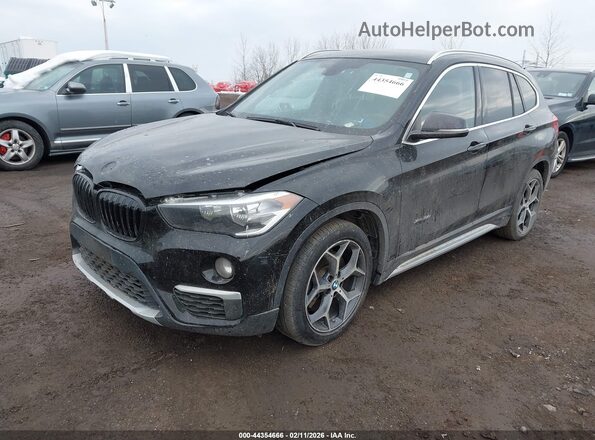WBXHT3C30GP883734 2016 BMW X1 Black Vista tres cuartos delantera izquierda