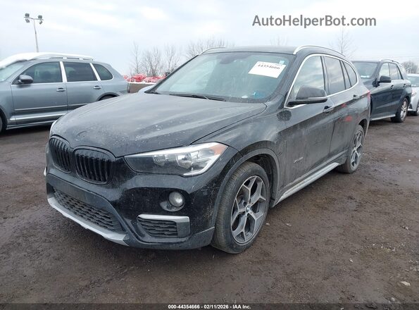 WBXHT3C30GP883734 2016 BMW X1 Black Vista frontal
